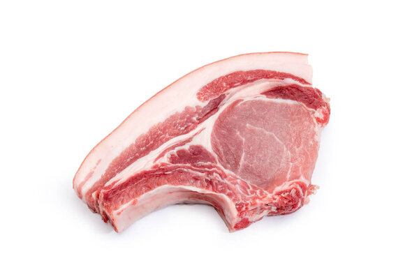 Uncooked pork loin chop with rib on a white background