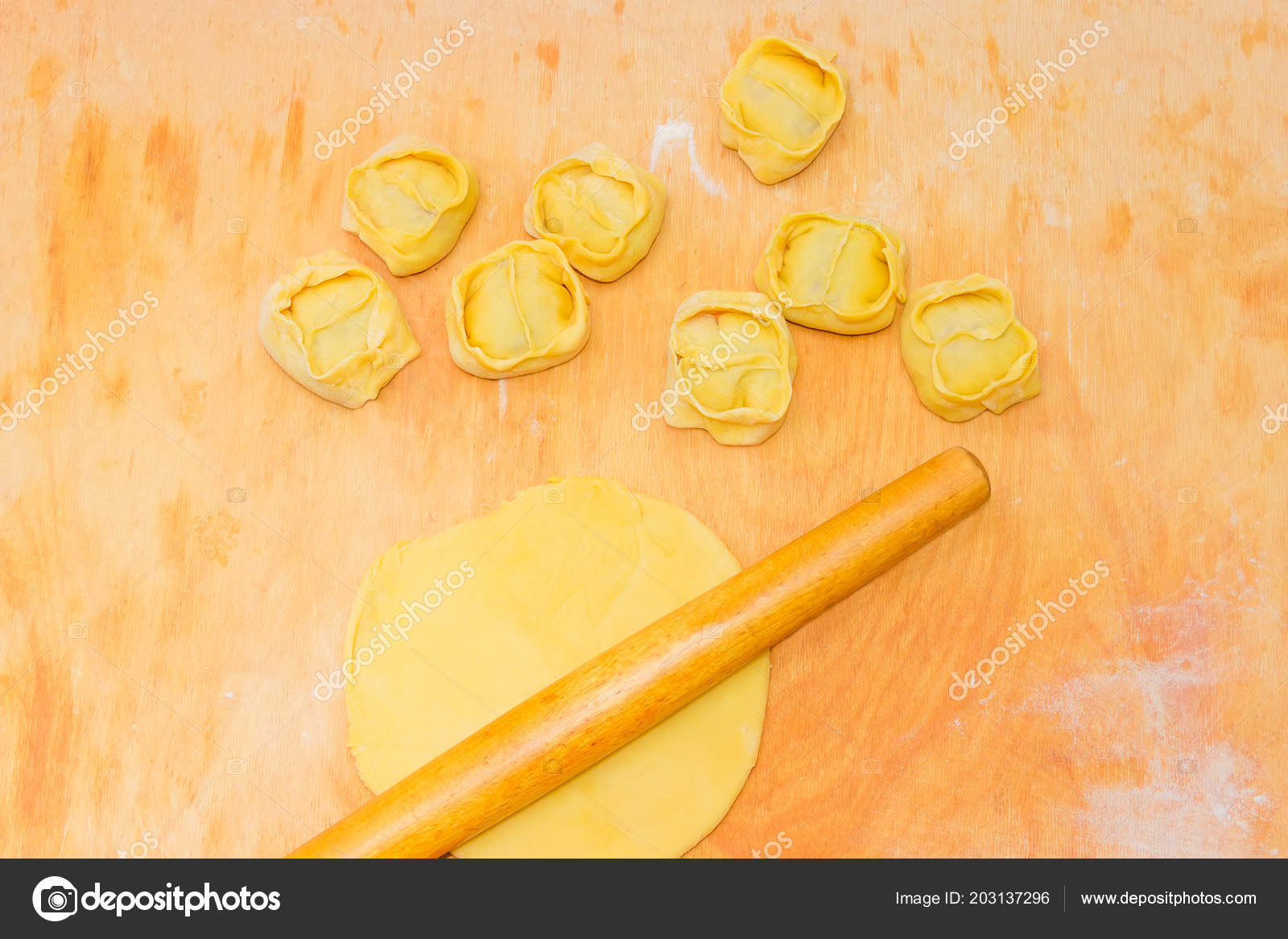 Freshly Prepared Uncooked Manti Dumplings Ed Meat Mixture Dish Freshly Prepared Uncooked Manti Dumplings With Ed Meat Mixture Dish Of The Turkic Cuisines During Preparing And Rolling Pin On Dough A Big Wooden