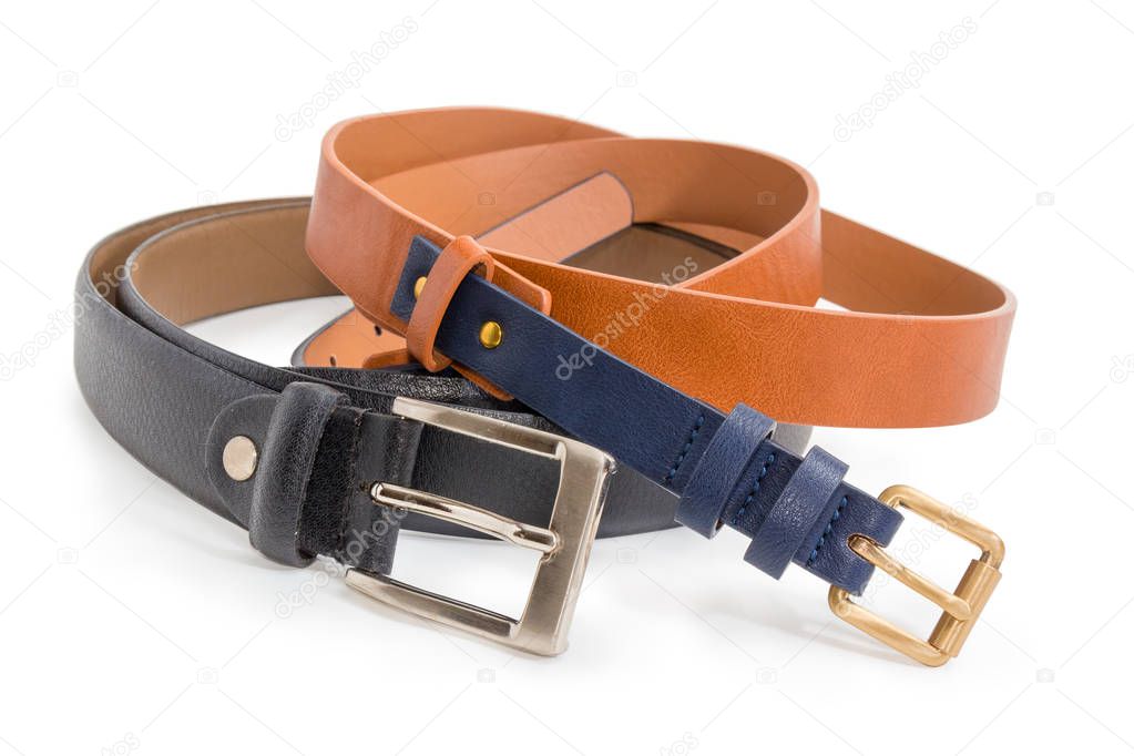 Brown-black synthetic belt for women and black leather belt for men with conventional buckles with square frames close-up at selective focus on a white background
