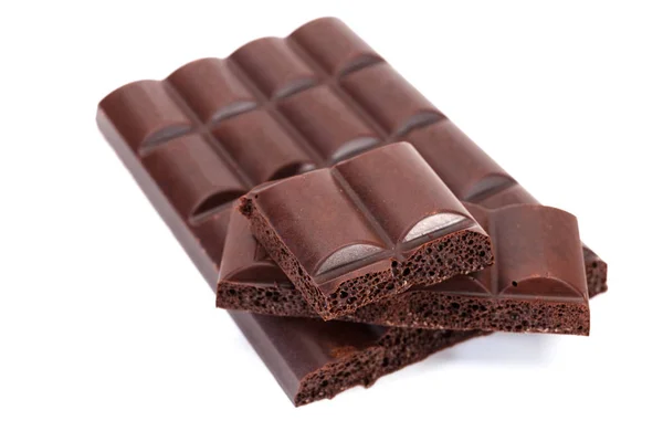 Splitted Block Dark Aerated Chocolate Close Selective Focus White Background — Stock Photo, Image