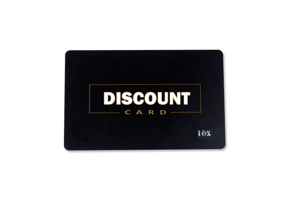 Plastic discount card with black background and yellow with white inscriptions close-up on a white background