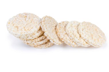 Kuru yuvarlak kahvaltılık crispbreads kahverengi pirinç beyaz zemin üzerine yapılan