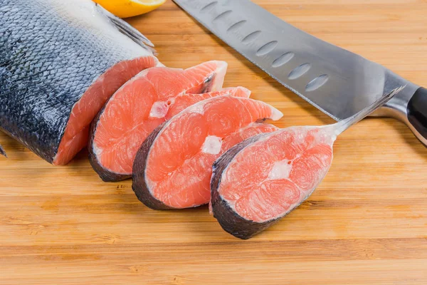 Uncooked Fresh Salmon Steaks Sliced Piece Fish Kitchen Knife Bamboo — Stock Photo, Image