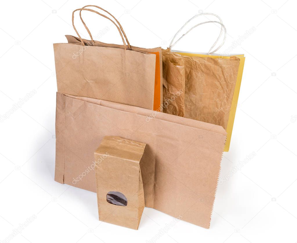 Different brown paper food packaging and shopping bags without plastic on a white background