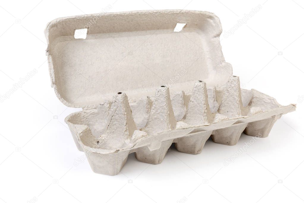 Open empty egg carton for ten eggs made of recyclable paper pulp on a white background