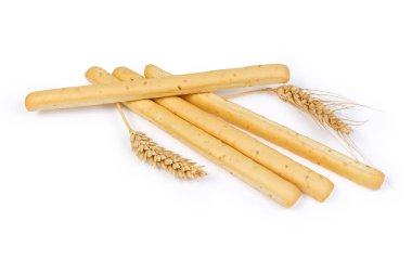 Susam ile breadsticks olarak da bilinen beyaz bir arka plan grisini ve buğday kulaklara tohum