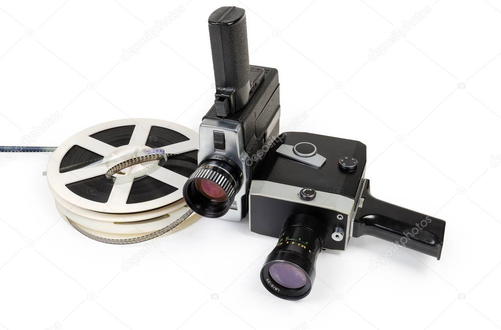 Two different vintage amateur film movie cameras and reels of color motion picture films Super 8mm format close-up on a white background