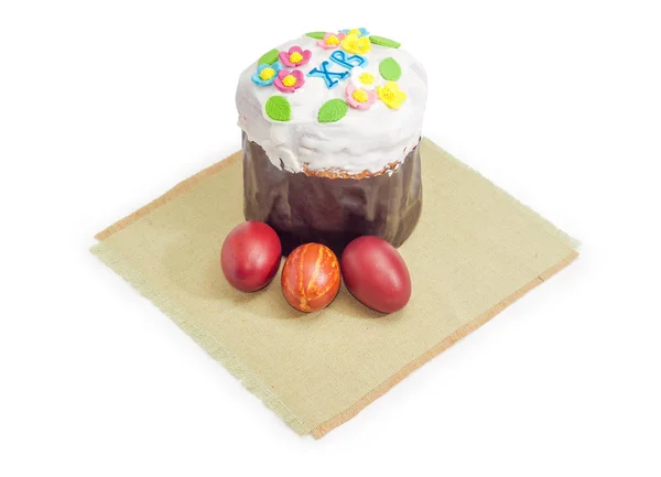 Sweet Easter bread and Easter eggs on napkin — Stock Photo, Image