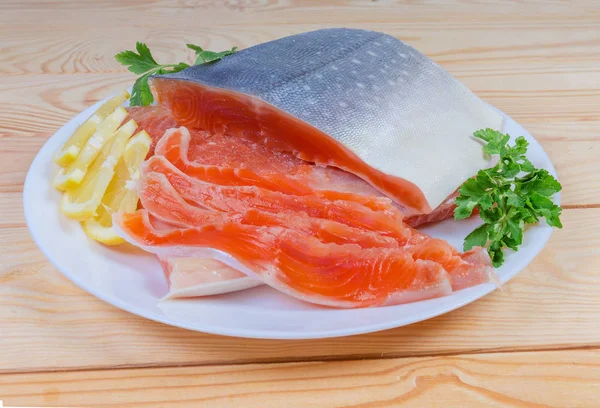 Partly sliced salted arctic char on dish on rustic table — Stock Photo, Image