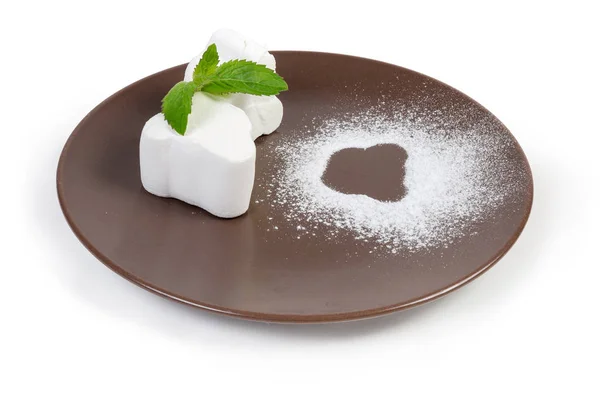 White marshmallow with mint leaves on a brown dish — 스톡 사진