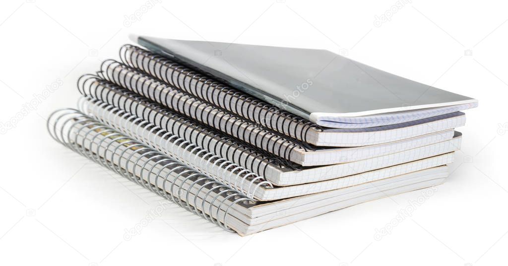 Stack of the different exercise books with wire spiral binding 