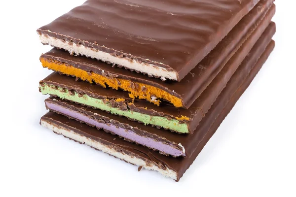 Bars of milk chocolate with varicolored filling close-up — Stock Photo, Image