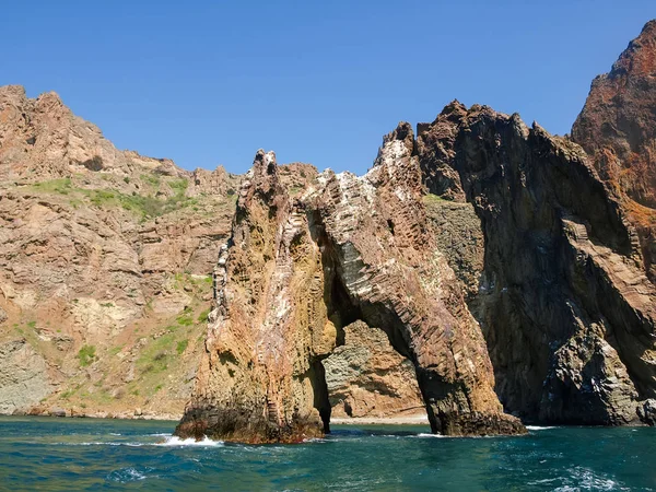 Rock arch of volcanic origin near the sea shore