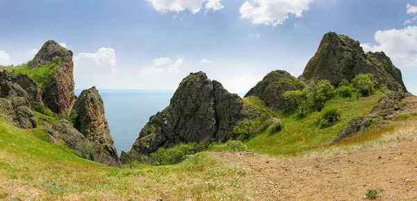 Rocky ridge volcanic origin above the sea