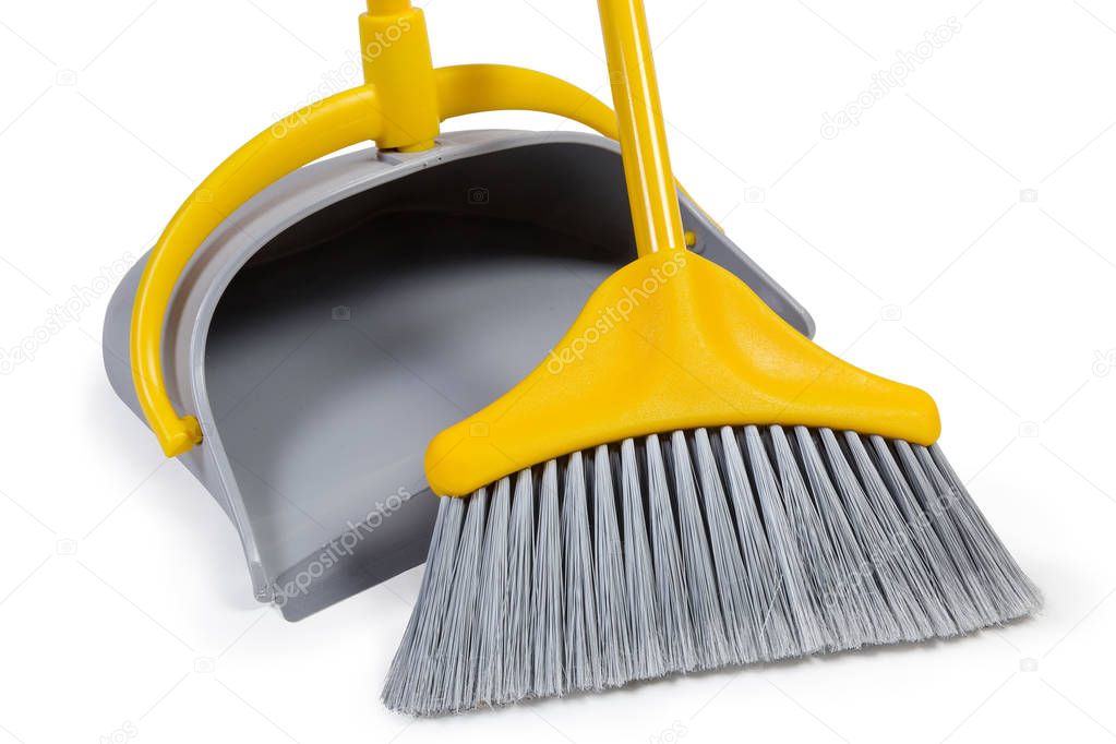 Plastic broom for sweeping floors and dustpan, fragment close-up