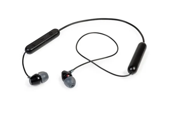 Black wireless earphones on a white background — Stock Photo, Image