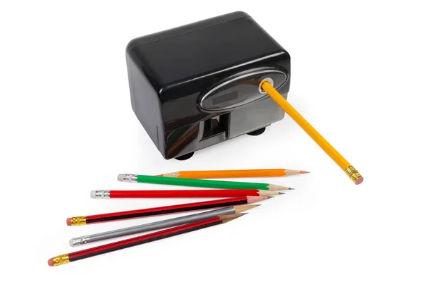 Desk electric pencil sharpener and pencils on a white background — Stock Photo, Image