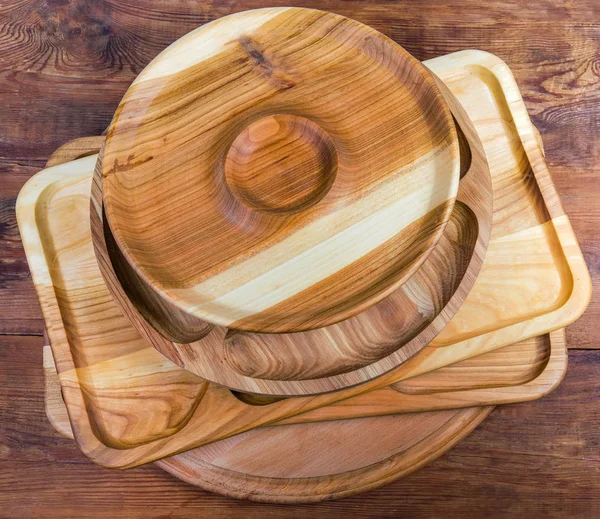 Top view of wooden compartment dishes and serving boards stack — Stock Photo, Image