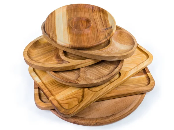 Stack of the wooden compartment dishes and serving boards — Stock Photo, Image