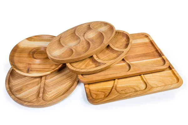 Different wooden compartment dishes and serving boards on white background — Stock Photo, Image
