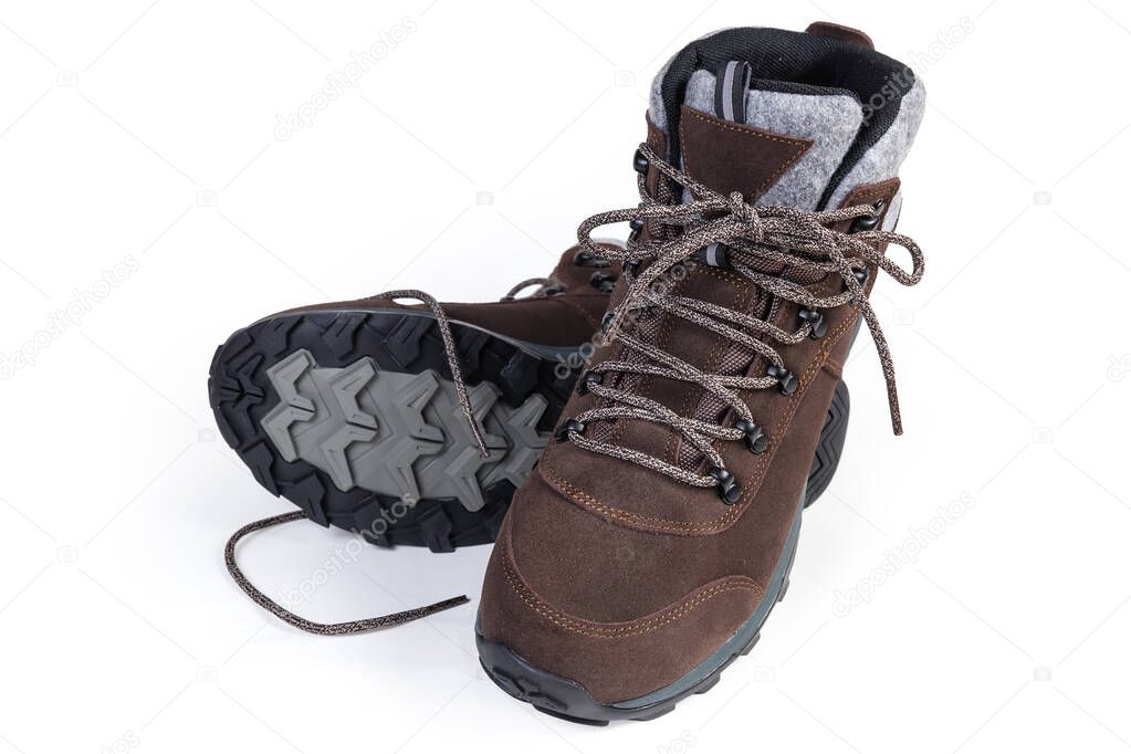 Pair of brown leather trekking boot on a white background