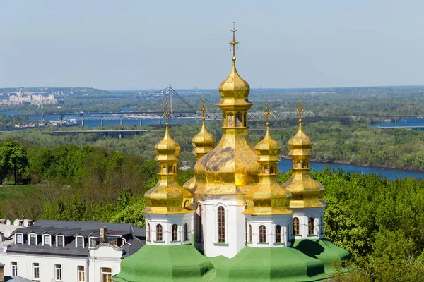 Domes of the Church of All Saints over the Economic Gate 17th century of Kyiv Pechersk Lavra, Ukraine. View from the Lavra bell tower