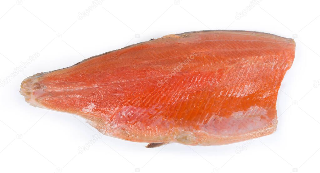 Defrosted trout fillet on the skin lies skin down, top view on a white background