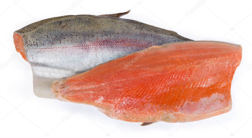 Two pices of the trout fillet on the skin as a boneless halves of the fish are lying skin side up and down, top view on a white background