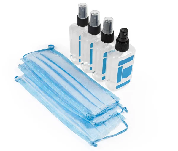 Lichtblauwe Wegwerp Medische Maskers Antiseptische Flessen Vorm Spray Een Witte — Stockfoto