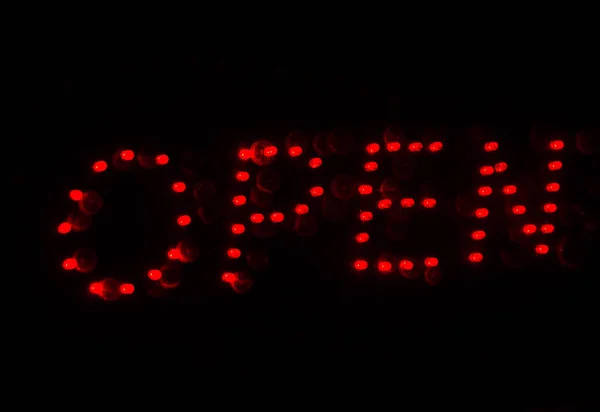 Red light written Open outside a restaurants