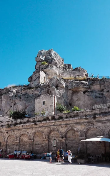 Characteristic white houses in a square with tourists of Matera also called City of the stones European Capital of Culture 2019