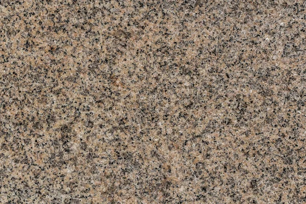 A beautiful texture of natural gray and yellow granite stone surface in the photo Stock Image