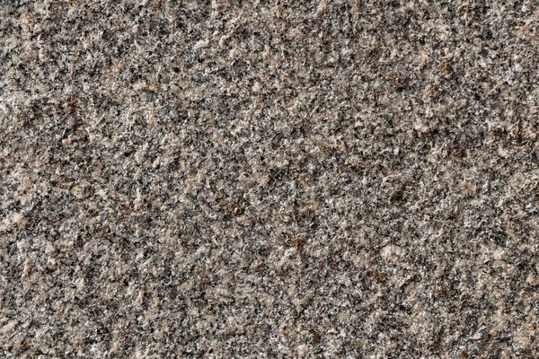 Uma bela textura de cinza natural e superfície de pedra de granito amarelo na foto — Fotografia de Stock