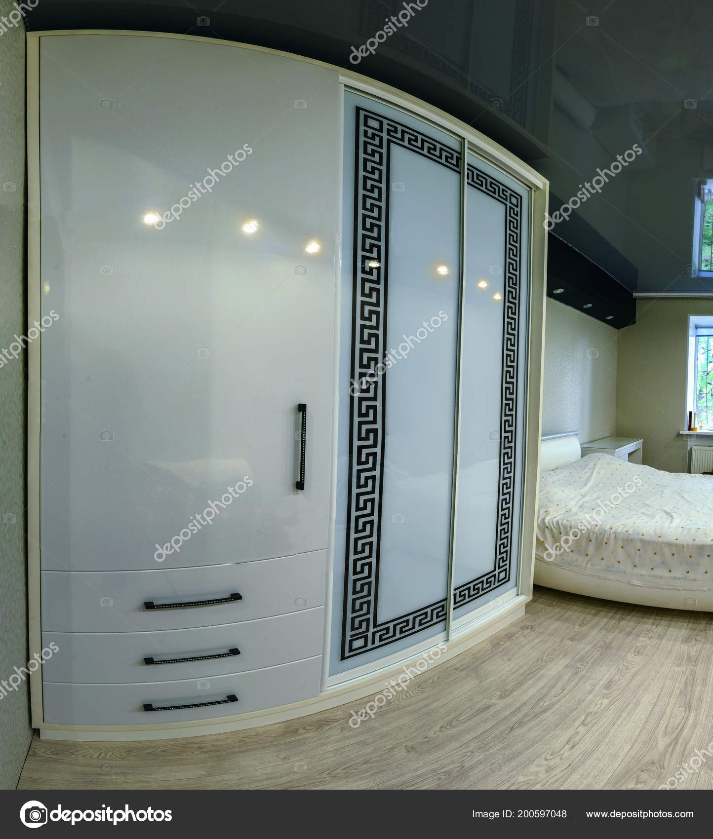 White Sliding Wardrobe With Glass Sliding Doors Stock Photo