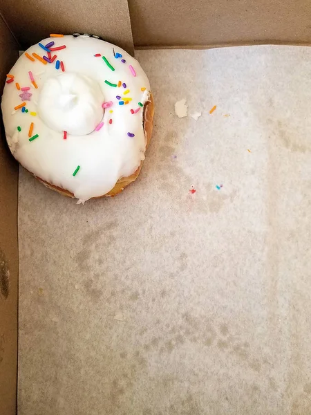 Single Donut White Icing Sprinkles Stained Paper Liner Bakery Box — Stock Photo, Image