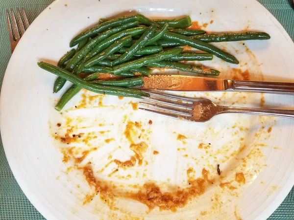 Leftover Green Beans Dinner Plate Silverware Tomato Sauce — Stock Photo, Image