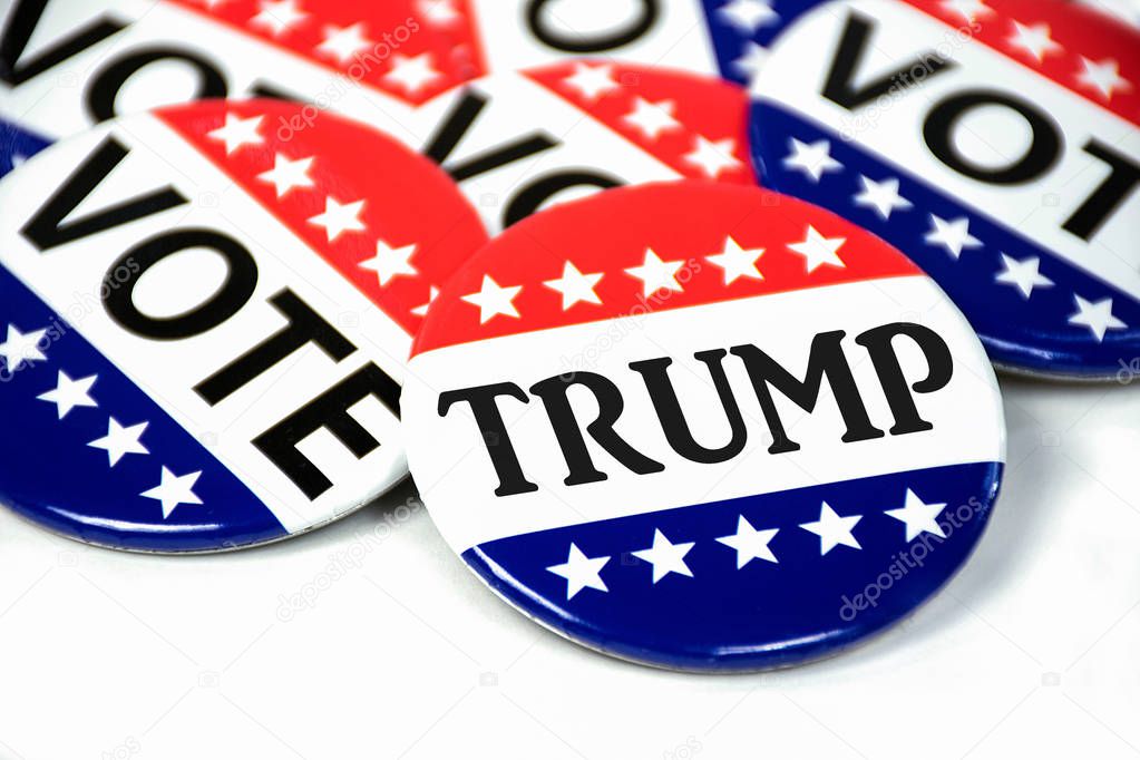close up of patriotic campaign vote button for Trump on white