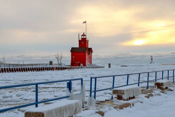 Big Red lighthouse in Holland Michigan in winter at sunset