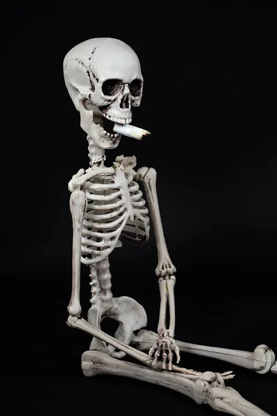 Skeleton Sitting Position Cigarette Butt Mouth Isolated Black — Stock Photo, Image