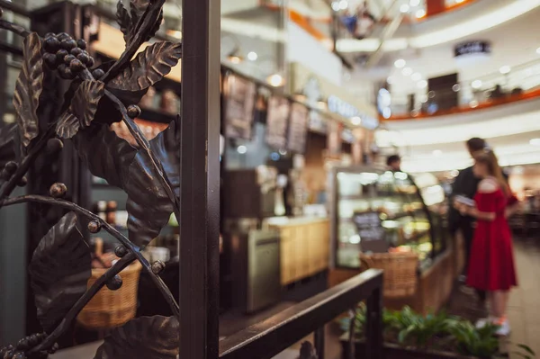 Background cafe, counter and customers in line, blurred