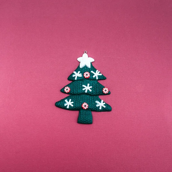 Stylish Christmas tree on a plain background. Minimalism, View from above, flat lay