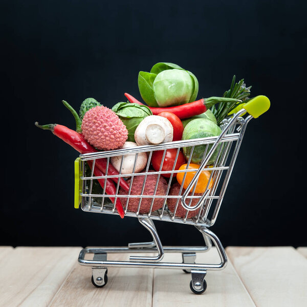 Organic  bio  fresh  fruit or vegetable  in  shopping cart
