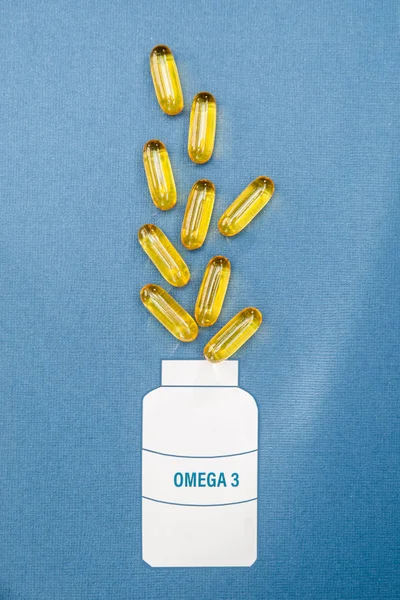 Fish oil omega 3 soft gel capsule pills, healthy product   and — Stock Photo, Image