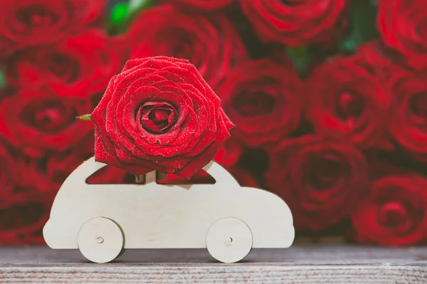 Concept of flower delivery, love, typewriter transports a flower