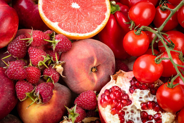 tray with fresh red vegetables and fruits Healthy eating vegetarian concept.