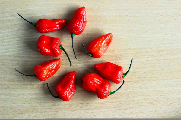 Bunch Red Bhoot Jolokia Spicy Ghost Pepper Isolated Wooden Background — Stock Photo, Image