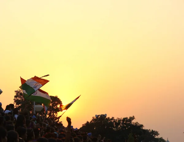 August 15,2018, Wagha Border, Amritsar, India. Indian flag waved by crowd during sunset at Wagha, India Pakistan Border at Amritsar India during Indian Independance day 2018.
