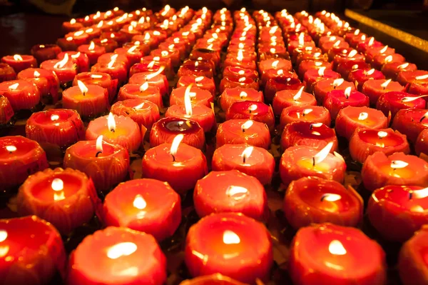 Rows of Chinese lotus candles captured in a Chinese temple