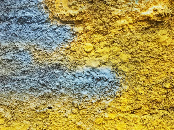 Abstract color painting on concrete block background (blue,green,yellow)  Smooth texture for design and decoration. Natural building material. Natural patterns on the stone. Plates for floor and walls