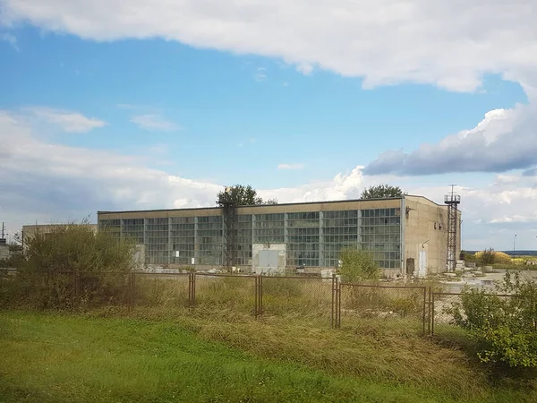 Panorama of the plant for the manufacture of various products. Production for the needs of the population. Industrial architecture and technical premises. Place of paid labor.